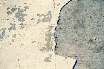 Old wall with a crack.Grunge background in dark color.