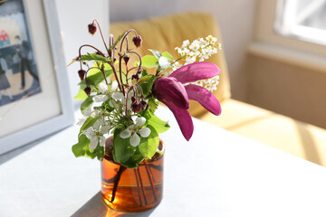 Bouquet with magnolia in a vase on the table
