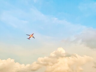 A photograph of an airplane with a seascape on the background