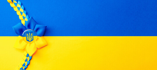 Ukraine symbol yellow background. Ukrainian flower trident symbol isolated on yellow blue flag....