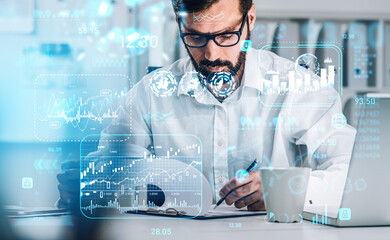 Businessman take note in clipboard, laptop on desk in office, stock market