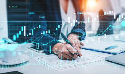 Businesswoman in formal wear working with documents at office workplace
