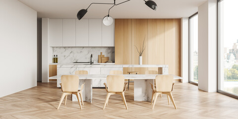Light kitchen interior with chairs and table, dining area and window