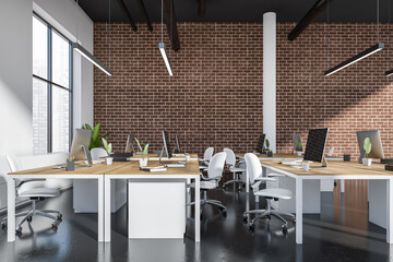 Coworking interior with pc computer, desk and panoramic window on city view