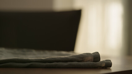linen napkin on walnut table