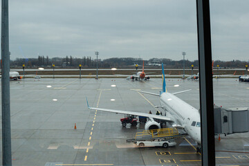 airport outside airplane window, waiting for flight. Airline travel concept.