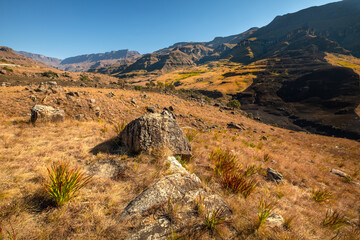 Valley and winding road over mountains from South Africa to Lesotho over Sani Pass.