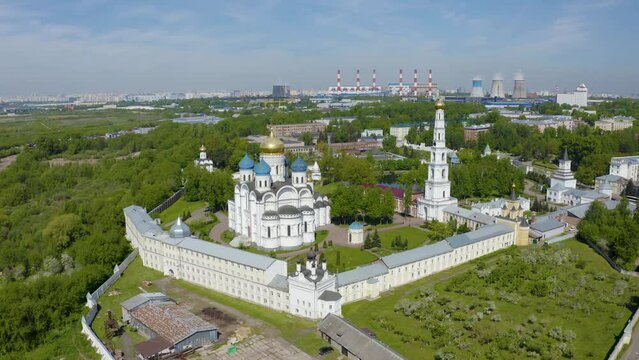 Orbit aerial footage of Nikolo-Ugreshsky monastery on sunny summer day. Dzerzhinsky, Moscow Oblast, Russia.