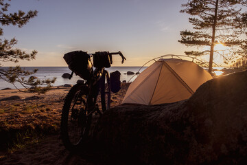 Cyclist's camp by the sea