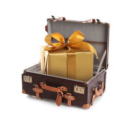 Beautiful gift box with golden bow in retro suitcase on white background