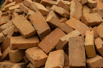 Solid clay brick used for construction. Background, brown red color