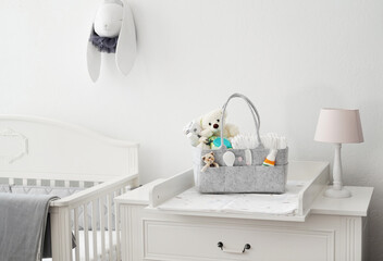 Mothers bag with toy and accessories on white background - 507596905