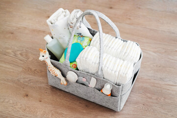 Mothers bag with toy and accessories on white background - 507596935