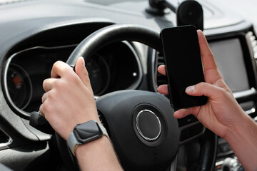 Man using phone in car