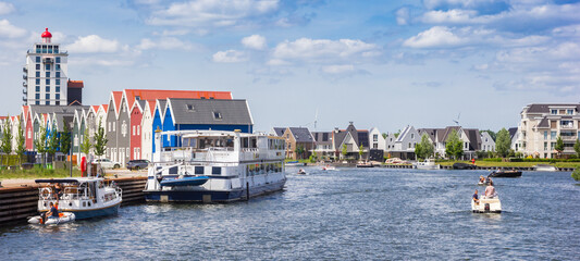 Panorama of a cruiseship and colorful houses in Harderwijk, Netherlands