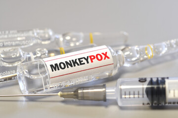 Vaccination for Smallpox and Monkeypox (MPXV). Syringe with vial of the doses vaccine for Monkeypox (MPXV) disease. - obrazy, fototapety, plakaty