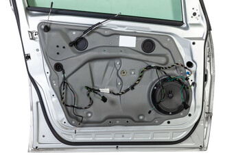 The multiband speaker of the audio system in the door with the car trim removed is connected with a...