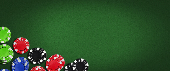 Poker chips on a green poker background.Copy Space. Place for text. Vignette. Gamble banner. Playing cards.