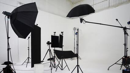 Studio video production lighting set. Behind the scenes shooting production set up by crew team...