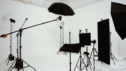 Studio video production lighting set. Behind the scenes shooting production set up by crew team...