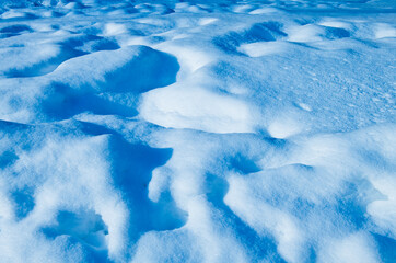 snowdrifts in cold and sunny winter day