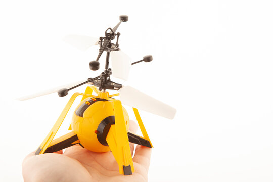 image of toy helicopter hand white background 