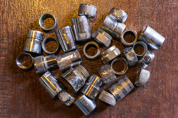 Old brass nuts and fittings for plumbing use recycling. Recycling of non-ferrous scrap.