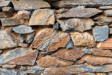 Rectangular stone wall in ocher tones