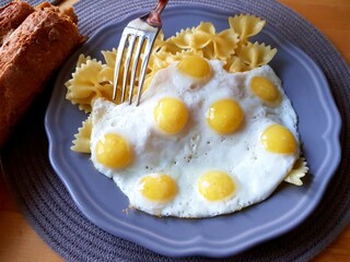 Fried eggs and pasta for breakfast
