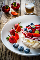 Pavlova meringue cake with cream and strawberries
