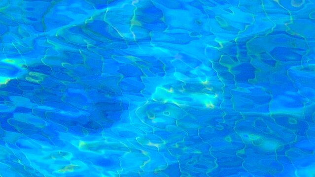 Blue rippling swimming pool water background 