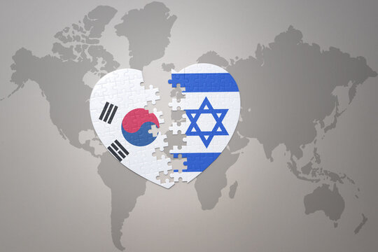 puzzle heart with the national flag of israel and south korea on a world map background. Concept.
