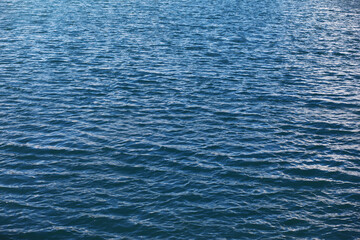 Water surface. The texture of the water. Waves on the lake in windy weather.