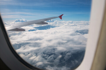 Fototapeta premium Cloudscape view from window of flying airplane
