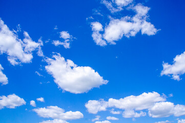 Obraz na płótnie Canvas Blue sky summer background with white fluffy clouds.