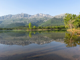 rare and virgin water pond and idyllic landscapes and reflections © emerald_media