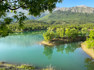 rare and virgin water pond and idyllic landscapes and reflections © emerald_media