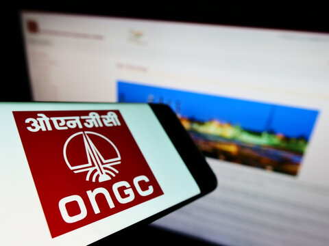 Stuttgart, Germany - 05-21-2022: Mobile phone with logo of Oil and Natural Gas Corporation Limited (ONGC) on screen in front of business website. Focus on left of phone display.
