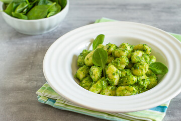 Homemade gnocchi with spinach pesto, healthy mediterranean food