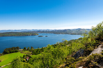 Fototapeta na wymiar A spectacular view from Lifjel mountain to a bay between Hommersak town and Uskjo island, Sandnes, Norway, May 2018
