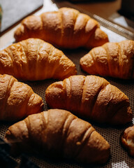 fresh croissants on a tray