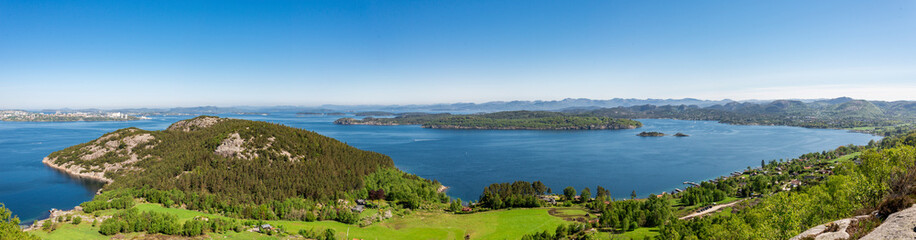Fototapeta na wymiar Panorama of stunning landscape of a bay near Hommersak town from Lifjel mountain, Norway, May 2018