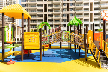 Fototapeta na wymiar playground for children in residential buildings in a sunny morning