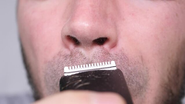 Man Shaves His Nostrils.  Slowmotion
