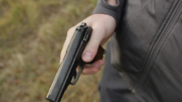 Charging Makarov Pistol in the Store
