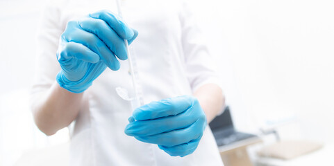 Gynecologist in blue gloves is taking smear analysis for research detect sexually transmitted...