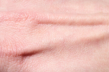 background of a pink skin texture. Healthy skin. Macro photo of skin cells.