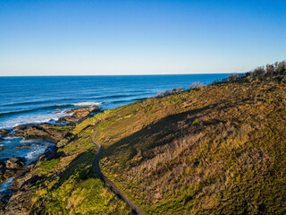 Aerial sunset view of ocean and hills