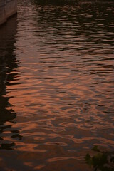 Reflections of the sunset in the water of the old town canal