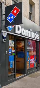 London, United Kingdom - August 12 2021:  The entrance to Dominos pizza take away on Old Street
